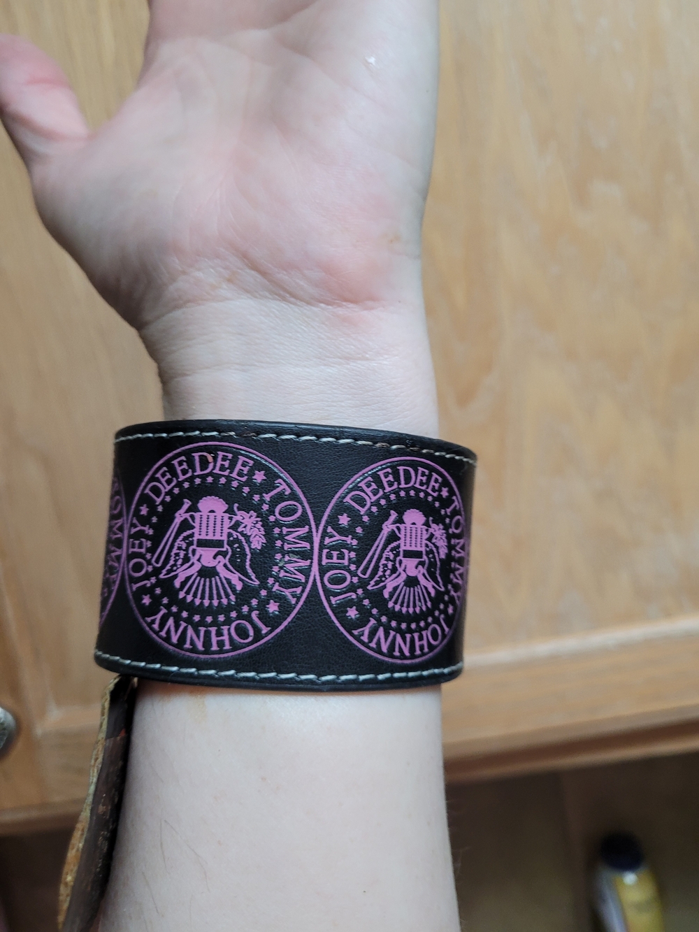 The Ramones Black  Cuff Bracelet with Pink Logo.